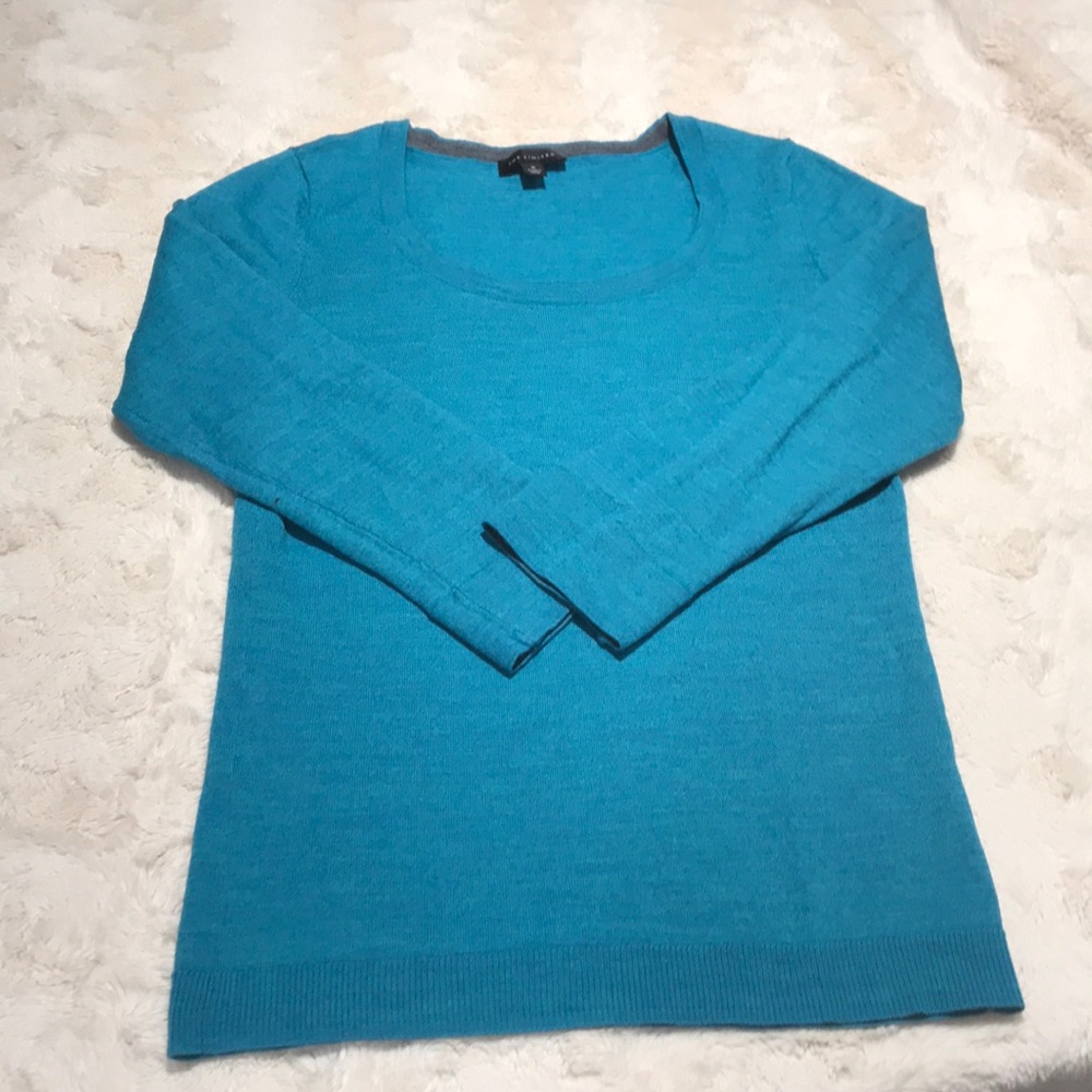 The limited top . Blue /green sweater